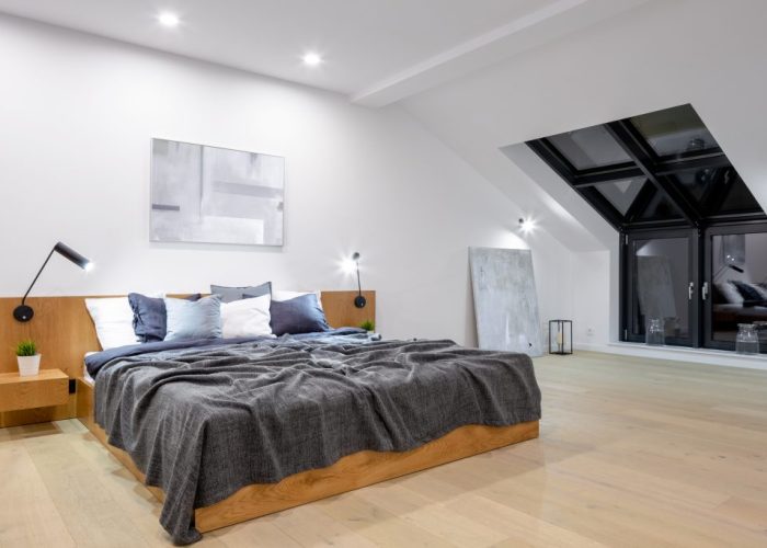 Big wooden bed in bedroom loft conversion bedroom north london finished attic room enfield